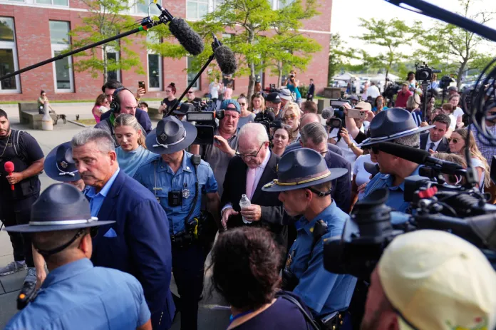 Defense attorney Kevin Reddington, center, leaves court, flanked by media and law enforcement, after the judge declared a mistrial in Lindsay Clancy's murder trial at Plymouth County Superior Court, Friday, Sept. 4, 2026, in Plymouth, Mass.