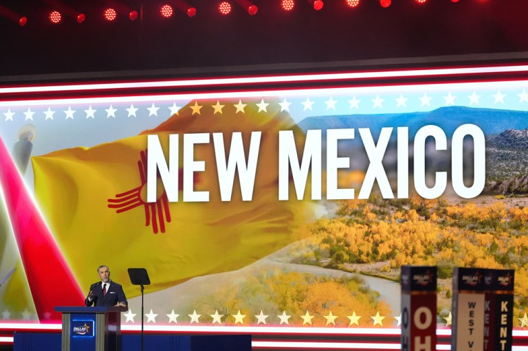 Greg Cunningham, candidate for U.S. House in New Mexico, speaks at the Republican convention Thursday, Sept. 10, 2026, in Dallas in front of a sizable New Mexico sign projected behind him. (AP Photo/Alex Brandon)