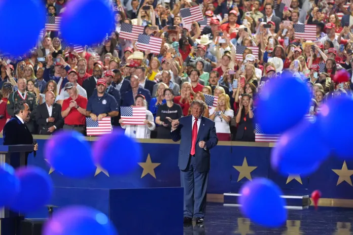 President Donald Trump gestures as balloons fall at the Republican convention Thursday, Sept. 10, 2026, in Dallas.