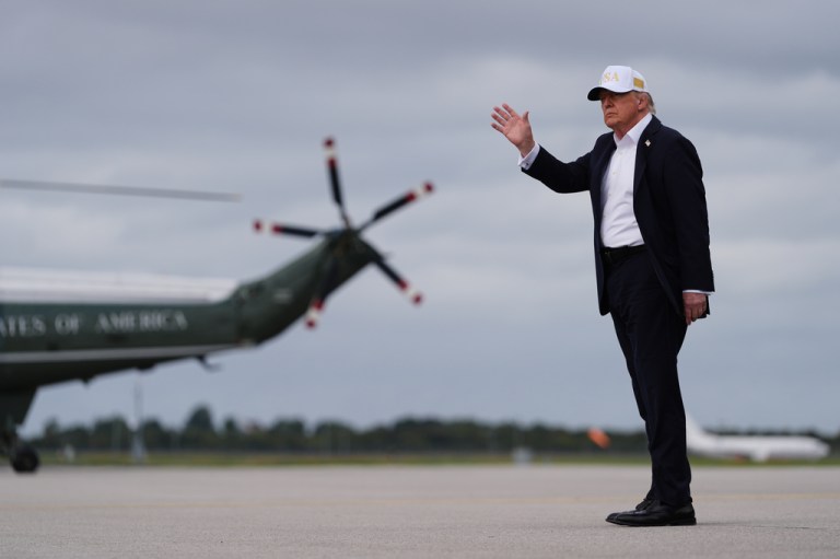 U.S. President Donald Trump waves after disembarking Air Force One on arrival at Shannon Airport in Shannon, Ireland.