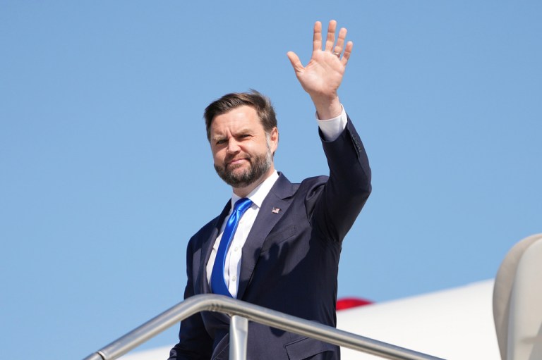 Vice President JD Vance waves as he steps off Air Force Two, Monday, Sept. 14, 2026, at Kansas City International Airport in Kansas City, Missouri with a blue sky behind him.
