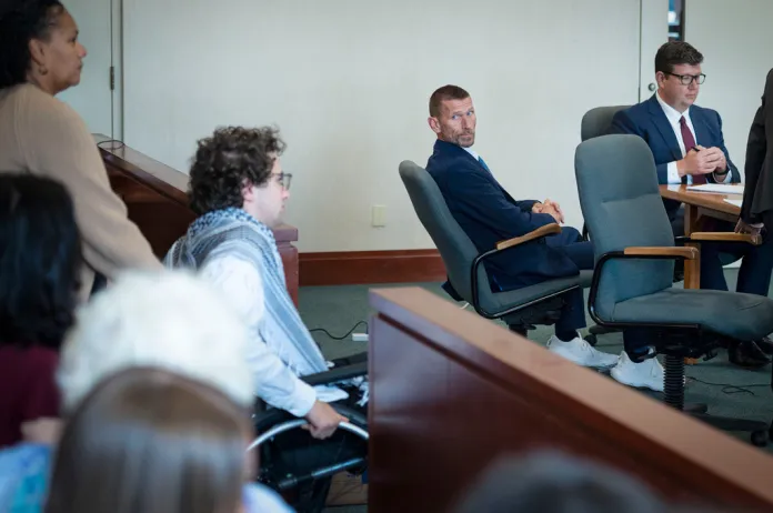 Jason Eaton watches as Hisham Awartani arrives to testify in Eaton's trial in Burlington, Vt., Monday, Sept. 14, 2026.
