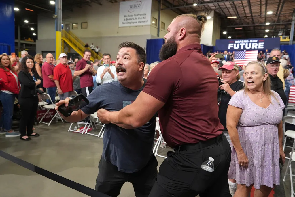 A protester is removed as Vice President JD Vance speaks during an event at Webco Manufacturing, Monday, Sept. 14, 2026, in Olathe, Kansas.