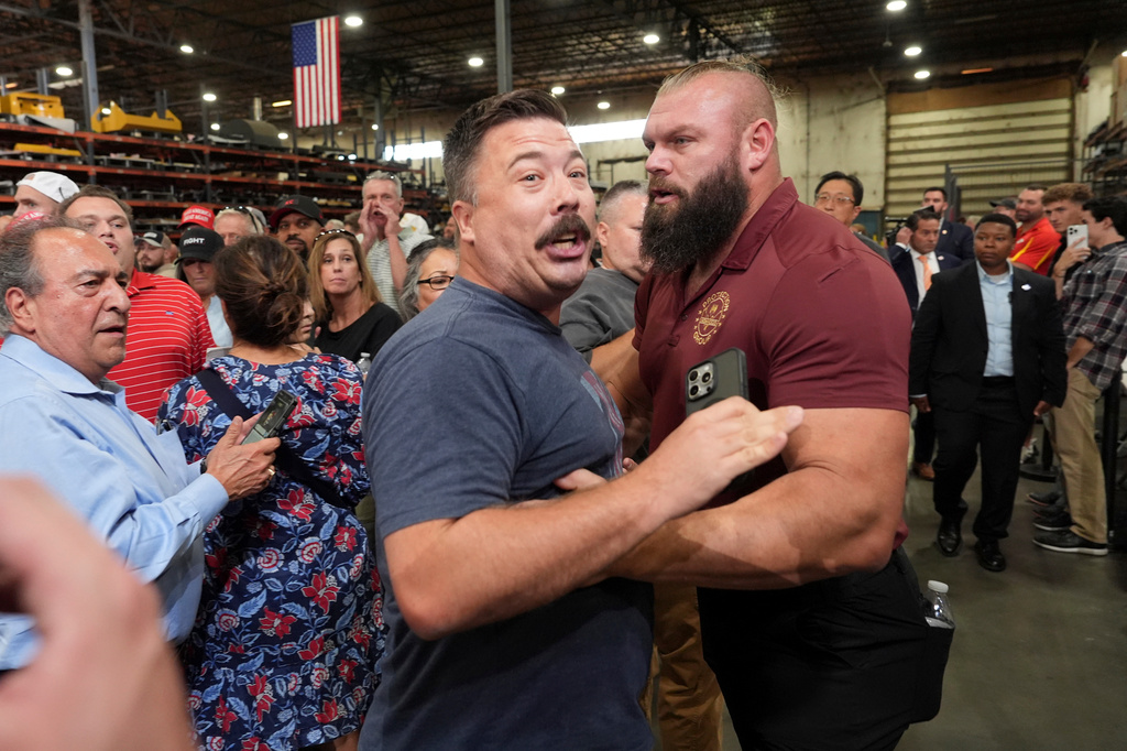 A protester is removed as Vice President JD Vance speaks during an event at Webco Manufacturing, Monday, Sept. 14, 2026, in Olathe, Kansas.