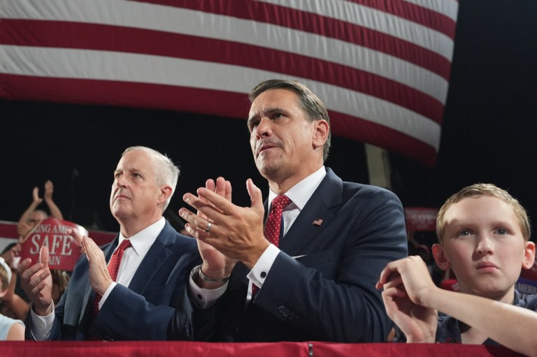 Attorney General Todd Blanche claps.