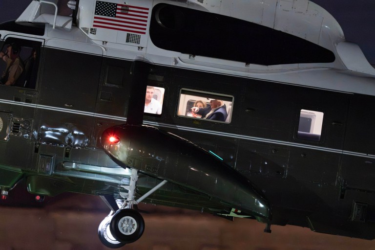 President Donald Trump seen sitting at a window seat in Marine One.