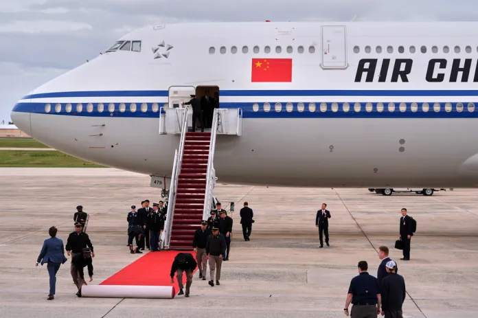 A red carpet is rolled out as an Air China airplane with Chinese President Xi Jinping and his wife Peng Liyuan aboard, arrives at Joint Base Andrews, Md., Wednesday, Sept. 23, 2026. (AP Photo/Mark Schiefelbein)