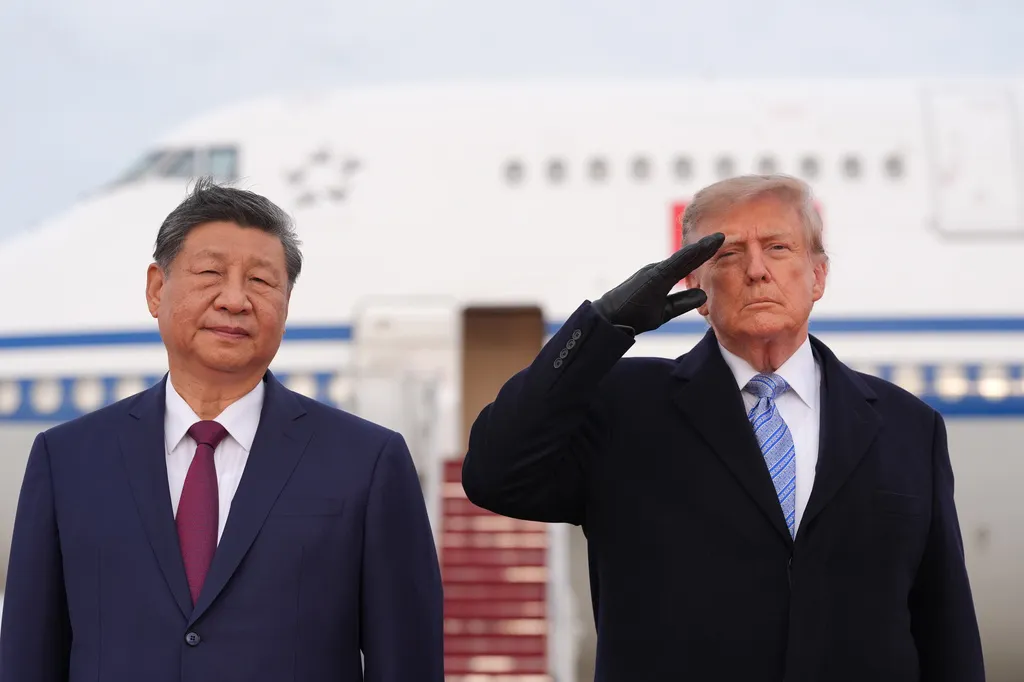 Trump winces during military flyover at Xi arrival ceremony