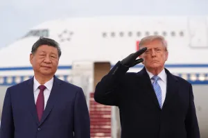 Trump winces during military flyover at Xi arrival ceremony