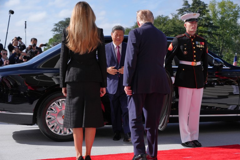 President Donald Trump and first lady Melania Trump greet China's President Xi Jinping and his wife Peng Liyuan on the South Portico of the White House.