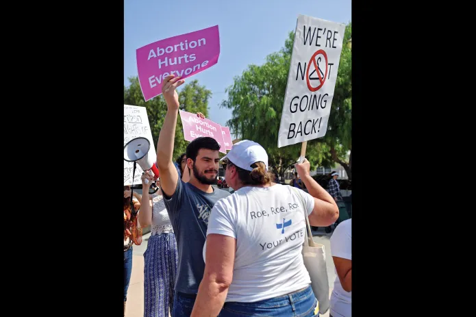 An abortion-rights activist, right, confronts an anti-abortion counter-protester in Los Angeles, Oct. 8, 2022. (Sarah Morris/Getty Images)