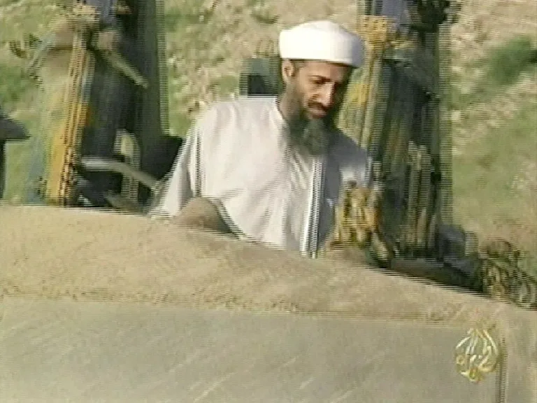 A TV grab from Al Jazeera channel shows Saudi born Osama bin Laden driving a bulldozer in Afghanistan in 1998.