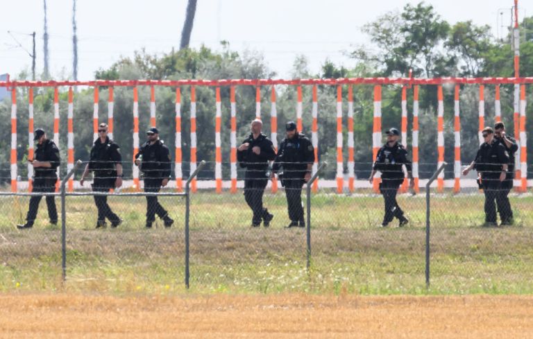 06 August 2026, Saxony, Schkeuditz: Police officers are searching the area away from the North Runway on the grounds of Leipzig/Halle Airport. Investigations are underway following the drone incident that occurred early Wednesday morning. According to security sources, the dronewhich was equipped for an attackwas recovered near a Ukrainian transport aircraft. Security authorities are on high alert.