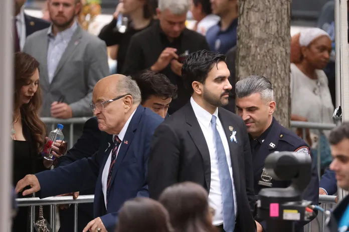 Zohran Mamdani, mayor of New York, center right, and Rudy Giuliani, former mayor of New York, center left, arrive ahead of the 25th anniversary commemoration ceremony at the National 9/11 Memorial and Museum in New York, US, on Friday, Sept. 11, 2026. Families and officials returned to the World Trade Center site on Friday to mark the 25th anniversary of the terrorist attacks on the United States on Sept. 11, 2001.