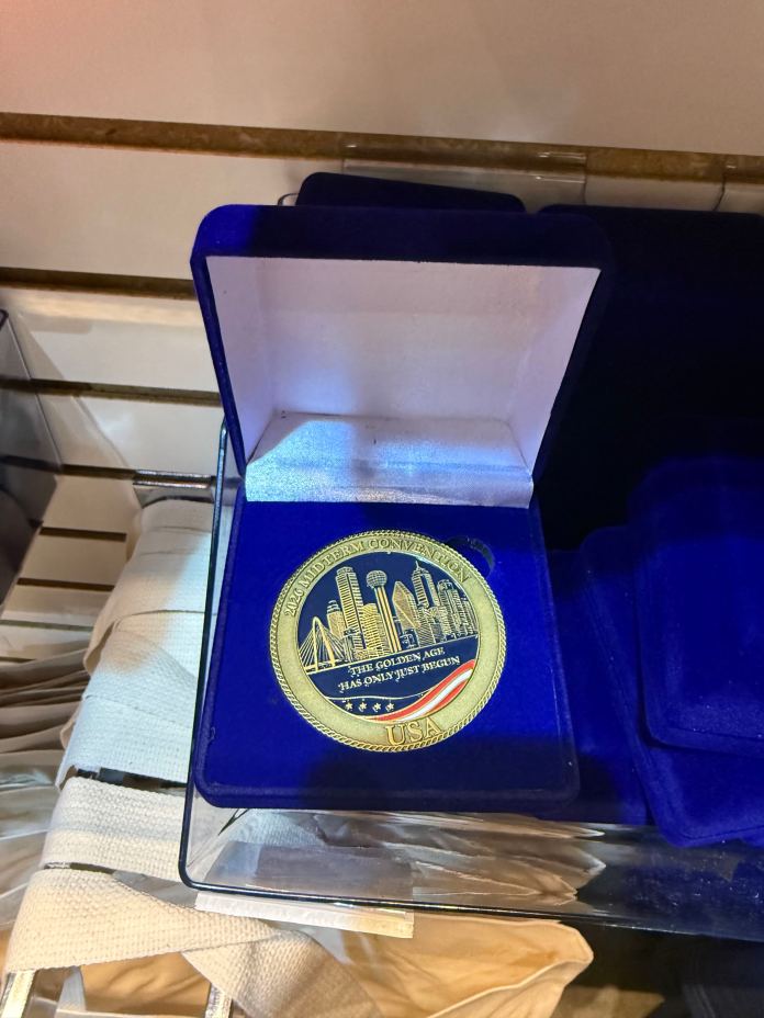 A commemorative coin for the GOP midterm convention with the label, "The Golden has only just begun." Wednesday, Sept. 9, 2026.