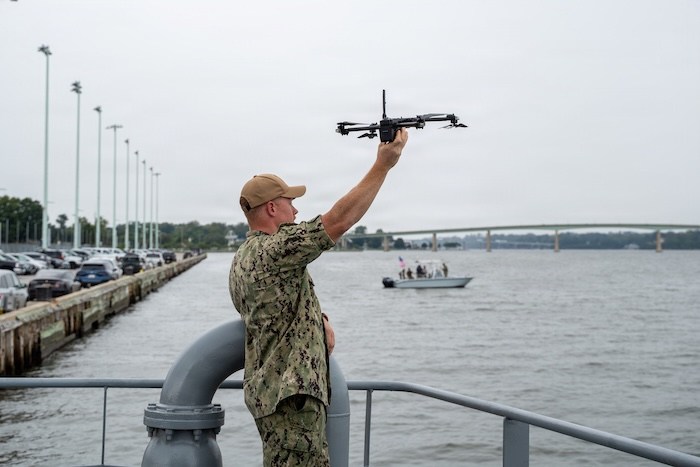 Chief of Naval Operations, Adm. Daryl Caudle, and Master Chief Petty Officer of the Navy John Perryman observe a robotics and autonomous systems demonstration onboard a Yard Patrol Craft during a visit to the United States Naval Academy.