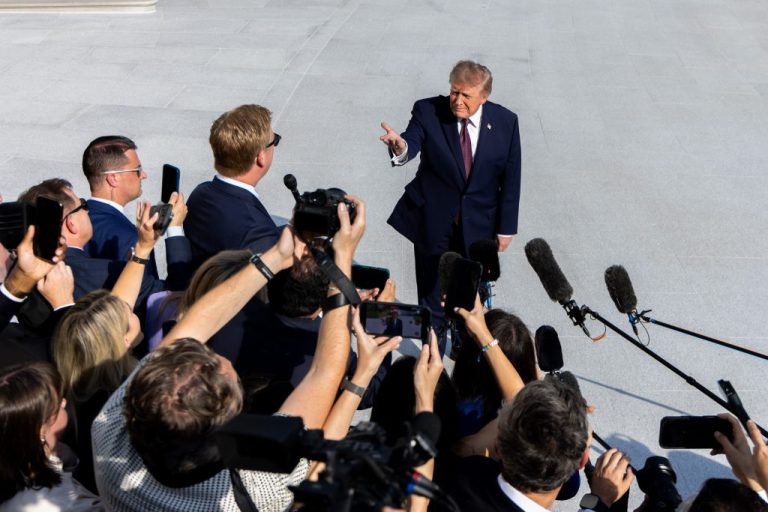 President Donald Trump speaks to members of the media.