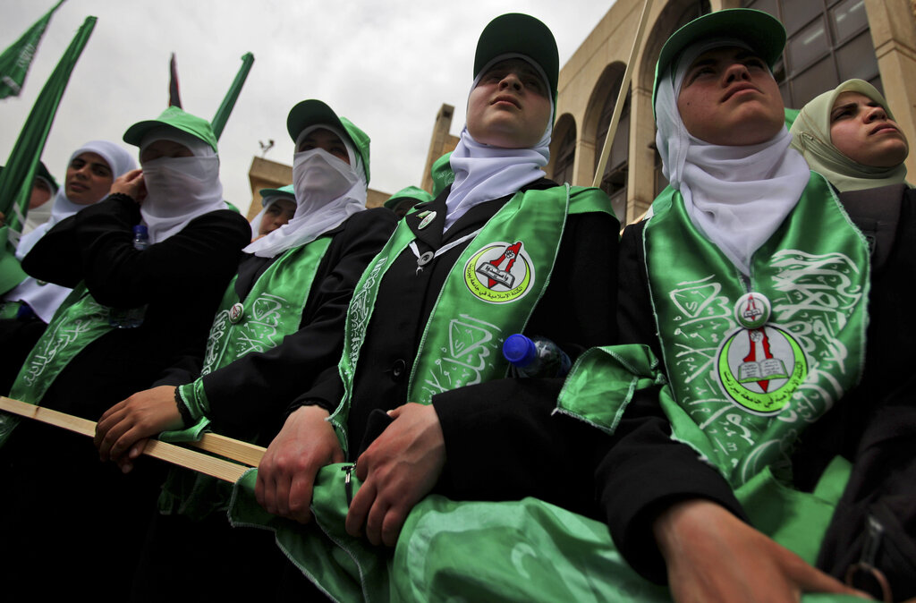 Palestinian student supporters of the Islamic group Hamas take part in a pre-election rally for the student council at Birzeit University