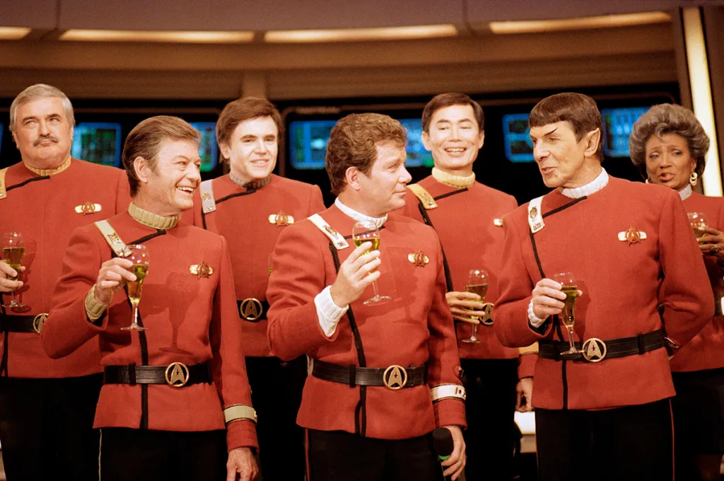 Members of the "Star Trek" crew, from left, James Doohan, DeForest Kelley, Walter Koenig, William Shatner, George Takei, Leonard Nimoy and Nichelle Nichols, toast the newest "Star Trek" film during a news conference at Paramount Studios in Los Angeles, Dec. 28, 1988. Nichols, who gained fame as Lt. Ntoya Uhura on the original "Star Trek" television series, died Saturday, July 30, 2022, at age 89. (AP Photo/Bob Galbraith, File)