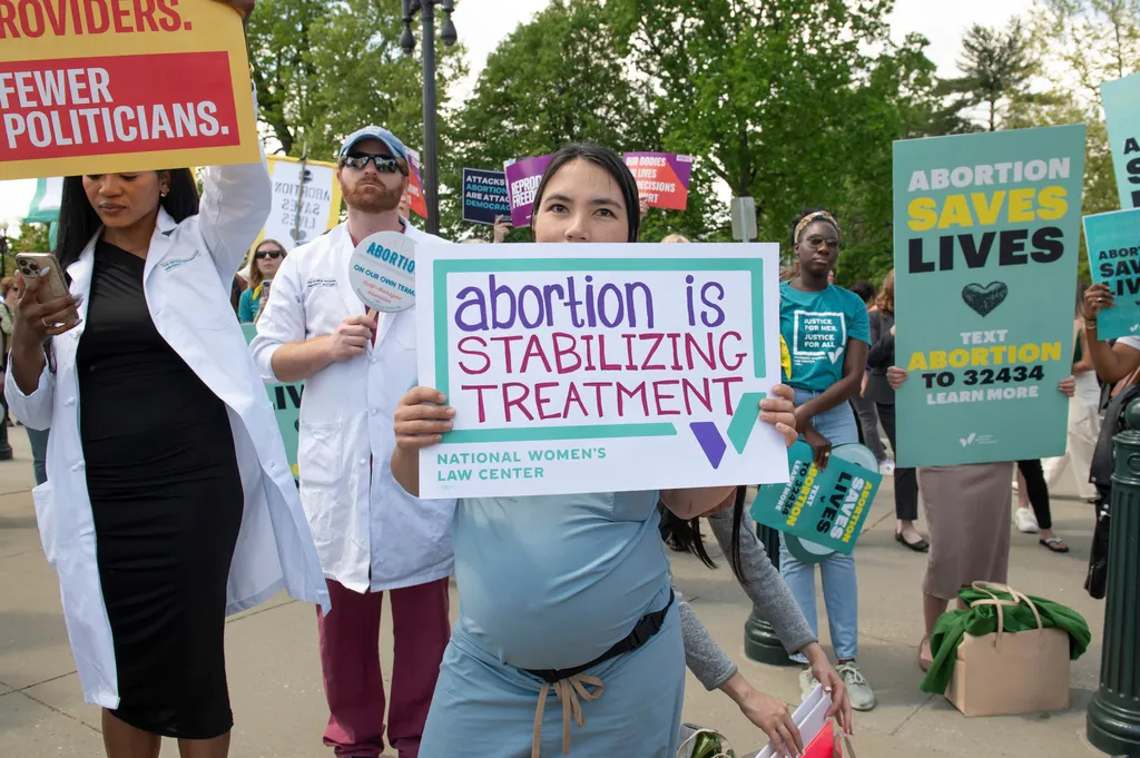 The National Women's Law Center and a coalition of reproductive health, rights, and justice groups hold an "abortion is healthcare" rally in front of the U.S. Supreme Court.