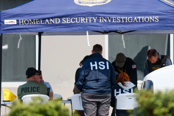 Agents from Homeland Security Investigations, the FBI, and the Sheriff from Bartow County conducted a major traffic crime labor search at Wellmade, a flooring manufacturer, on Tuesday, in Atlanta, Wednesday, March 26, 2025. According to public relations from HSI, one of the owners was taken into custody. (Miguel Martinez/Atlanta Journal-Constitution via AP)