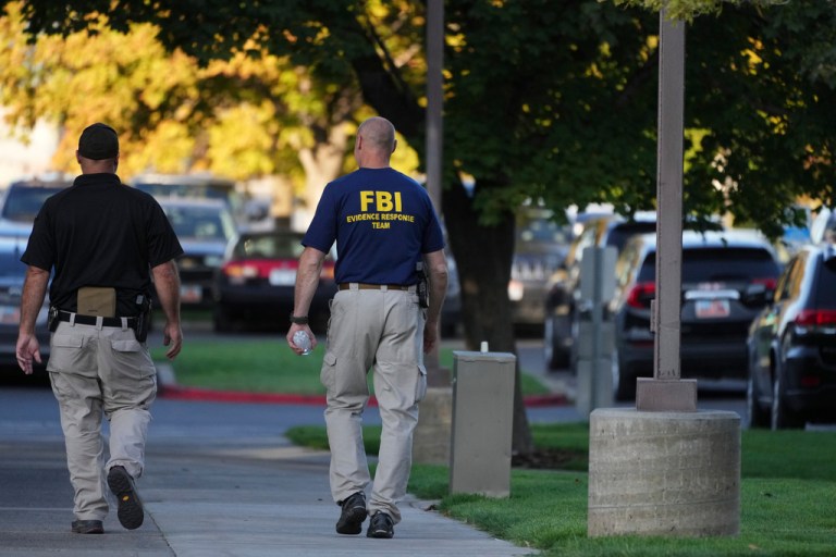 FBI and law enforcement walk outside the campus at Utah Valley University a day after Charlie Kirk was shot and killed, in Orem, Utah, Thursday,, Sept. 11, 2025.