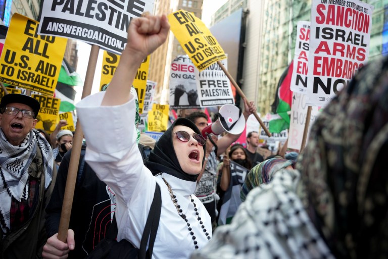 People protest in Times Square during a pro-Palestinian demonstration, Friday, Sept. 26, 2025, in New York. (AP Photo/Angelina Katsanis)