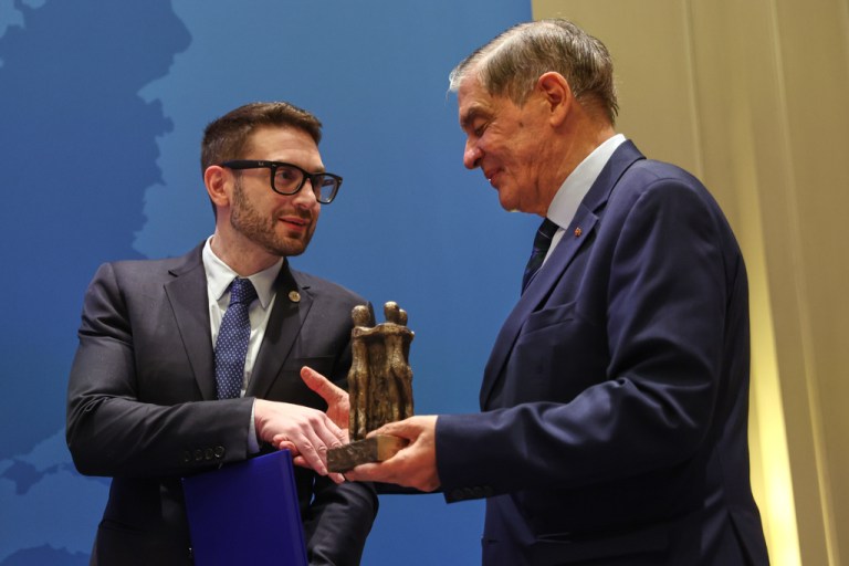 Alex Soros, left, accepts the European Civil Rights Prize of the Sinti and Roma on behalf of his father, George Soros, from Romani Rose the head of the Central Council of German Sinti and Roma, in Berlin, Thursday, Oct. 23, 2025.
