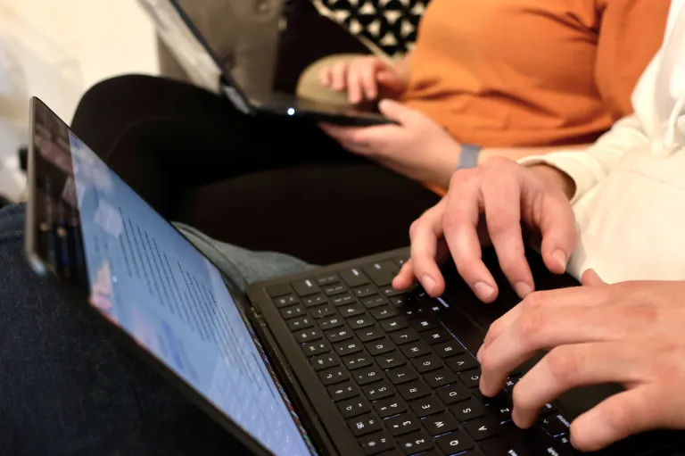 A person uses their laptop