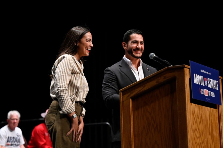 Michigan Democratic U.S. Senate primary candidate Abdul el Sayed, right, is joined onstage by U.S. Rep. Alexandria Ocasio-Cortez (D-NY) during a campaign rally in Detroit.