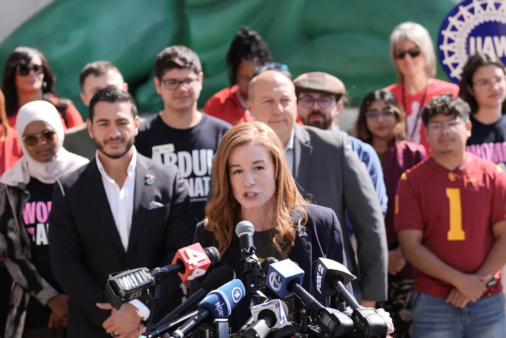 Michigan State Senator Mallory McMorrow, speaks during a news conference with Abdul El-Sayed, standing left, at the Spirit of Detroit shortly after El-Sayed was declared the winner of the Democratic nomination for U.S. Senate in Michigan, Wednesday, Aug. 5, 2026, in Detroit.