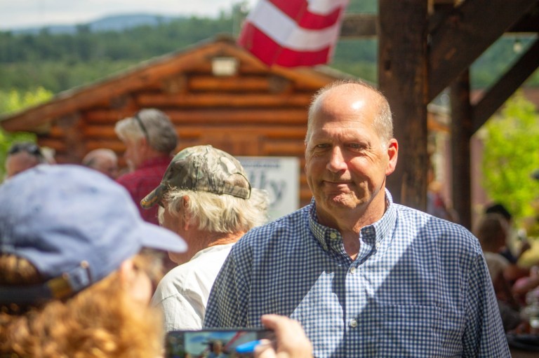 A supporter snaps a photo of former Sen. John E. Sununu as he campaigns for the GOP nomination for his old seat in Berlin, New Hampshire, Saturday, Aug. 22, 2026.