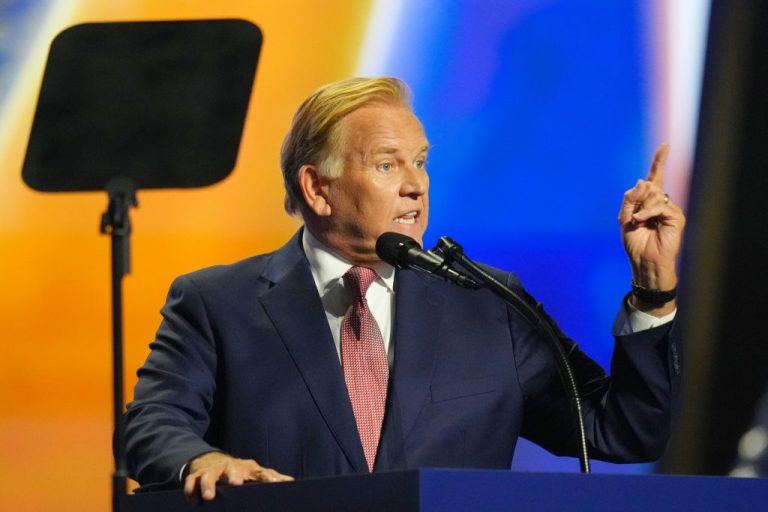 Republican Senate candidate Mike Rogers gestures with an upward pointed finger as he speaks at the Republican convention Thursday, Sept. 10, 2026, in Dallas.