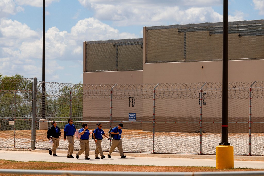 People walk toward the entrance of the South Texas ICE Processing Center in Pearsall, Texas, Monday, Sept. 21, 2026.