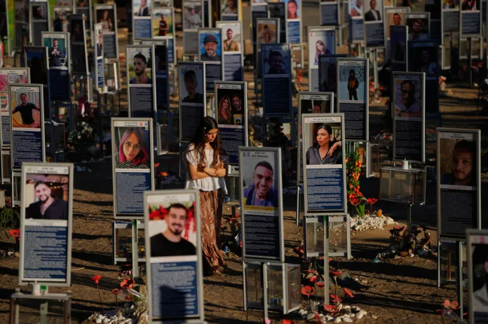 People mark the third anniversary of the Oct. 7, 2023, Hamas attack on Israel at the site of the Nova music festival.