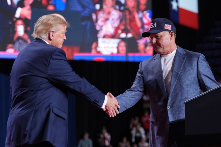 President Donald Trump greets Roger Clemens at a campaign rally at the Freeman Coliseum in San Antonio, Wednesday, Oct. 7, 2026.