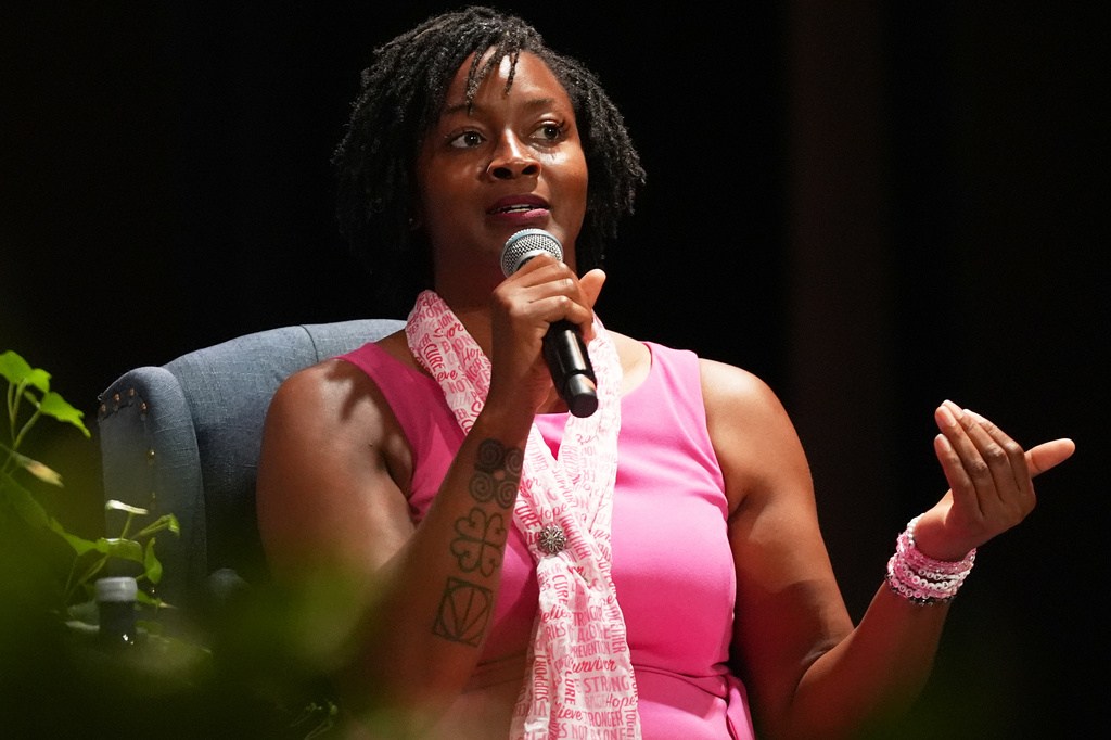Democratic candidate for U.S. Senate Angie Nixon speaks on stage during a fireside chat hosted by Rep. Frederica Wilson at Florida Memorial University.