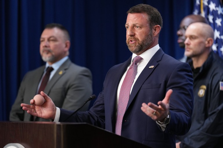 Secretary of Homeland Security Markwayne Mullin speaks during a news conference at ICE Headquarters.