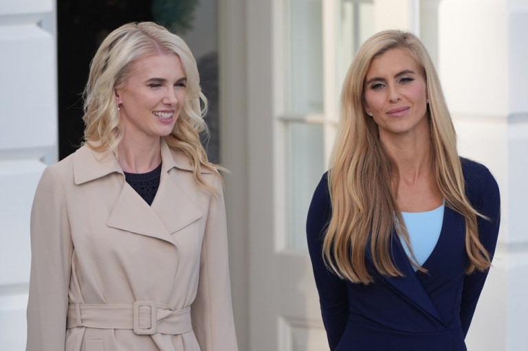 White House aide Natalie Harp, left, stands with White House press secretary Katie Zacharia as President Donald Trump speaks with reporters before departing on Marine One from the South Lawn of the White House, Monday, Oct. 12, 2026, in Washington.