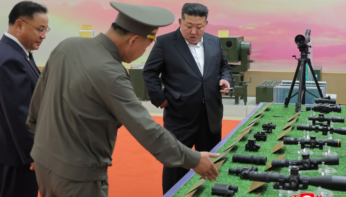 North Korea releases photos of Kim Jong Un at clothing expo after viral death rumors