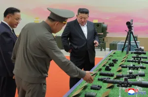 North Korea releases photos of Kim Jong Un at clothing expo after viral death rumors