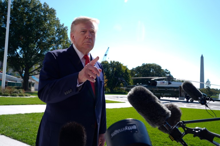 President Donald Trump talks to reporters before boarding Marine One.