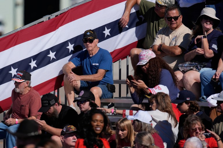 People arrive before President Donald Trump speaks at a campaign rally at the Laughlin Bullhead International Airport, Wednesday, Oct. 14, 2026, in Bullhead City, Ariz.