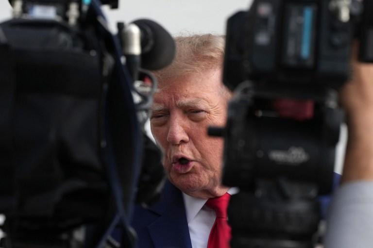 President Donald Trump speaks to reporters on the South Lawn of the White House.