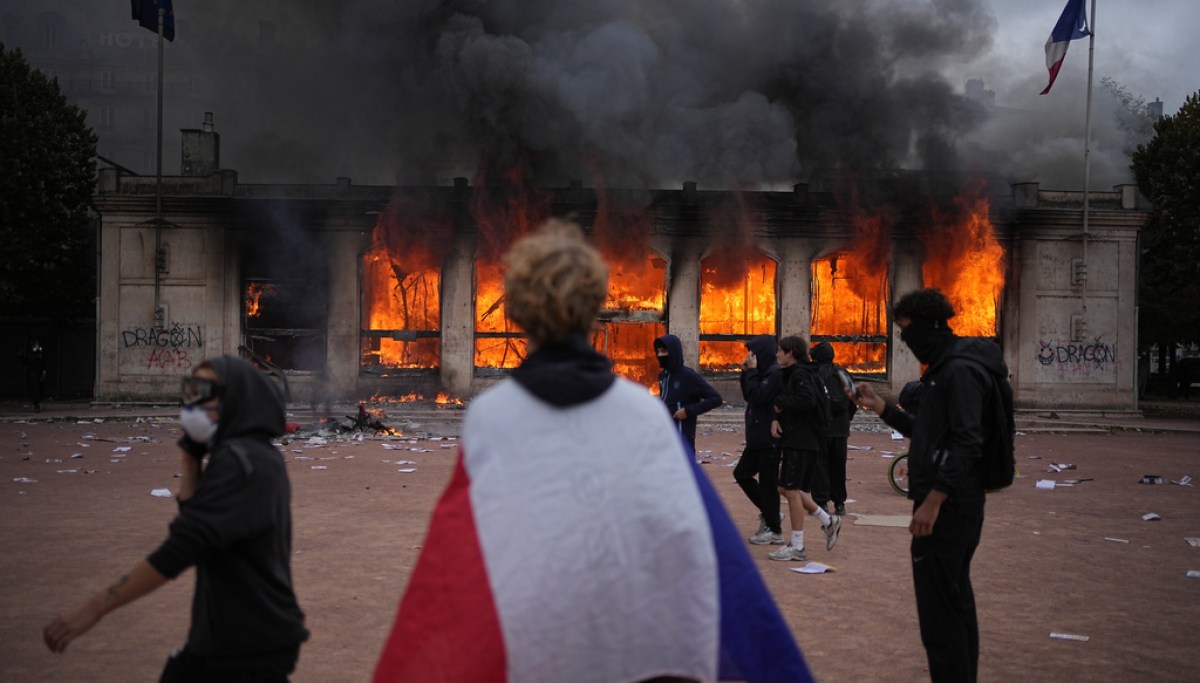 Trump tells France ‘close your borders’ as police arrest 1,800 in violent protests