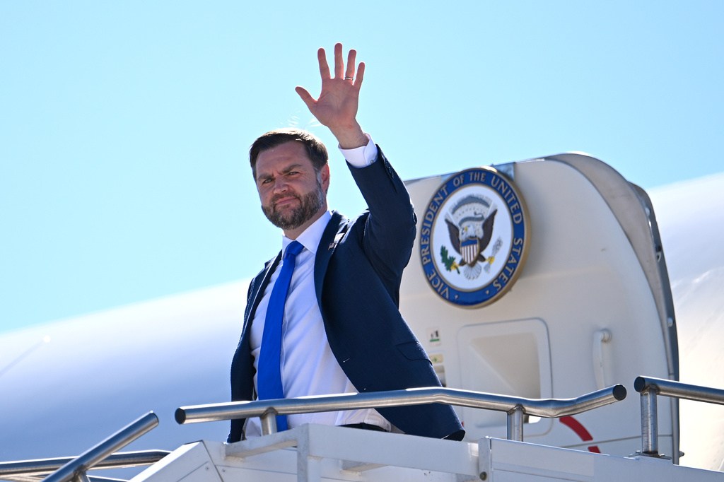 Vice President JD Vance waves upon arriving on Air Force Two at Asheville Regional Airport in Fletcher, North Carolina.