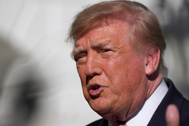 President Donald Trump speaks with reporters.