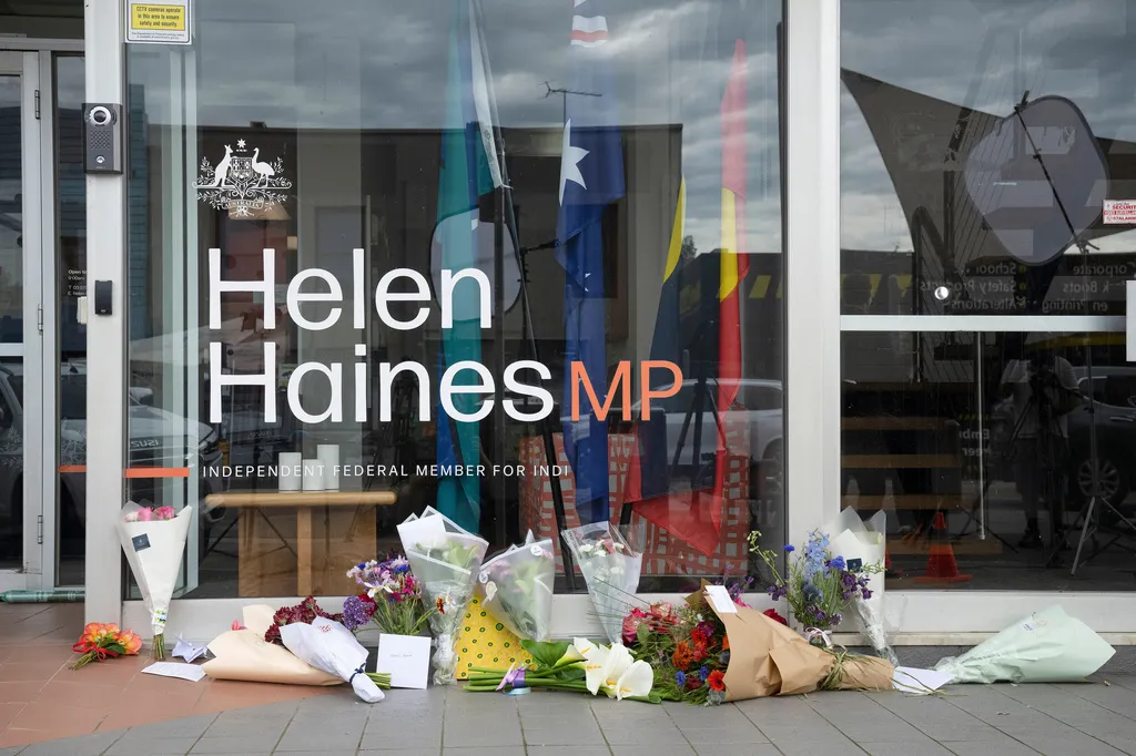 Tributes and flowers are placed outside the electoral office for independent member of parliament Helen Haines in Wangaratta, Australia, Tuesday, Oct. 20, 2026. (James Ross/AAPImage via AP)