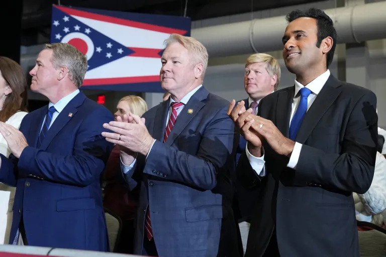 Sen. Jon Husted, R-Ohio, Rep. Warren Davidson, R-Ohio, and gubernatorial candidate Vivek Ramaswamy attend a campaign rally at the Sharonville Convention Center.