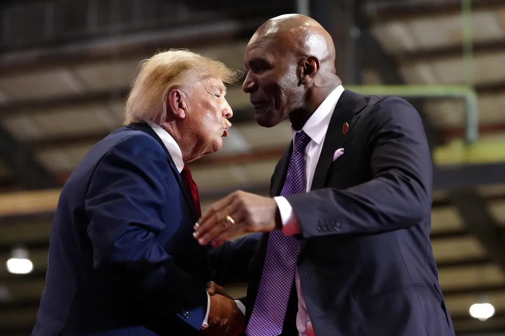Trump welcomes former heavyweight champion Evander Holyfield to stage